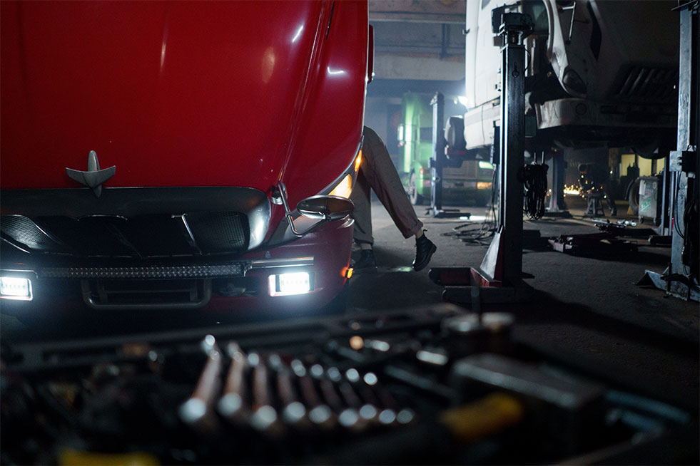 man checking a truck